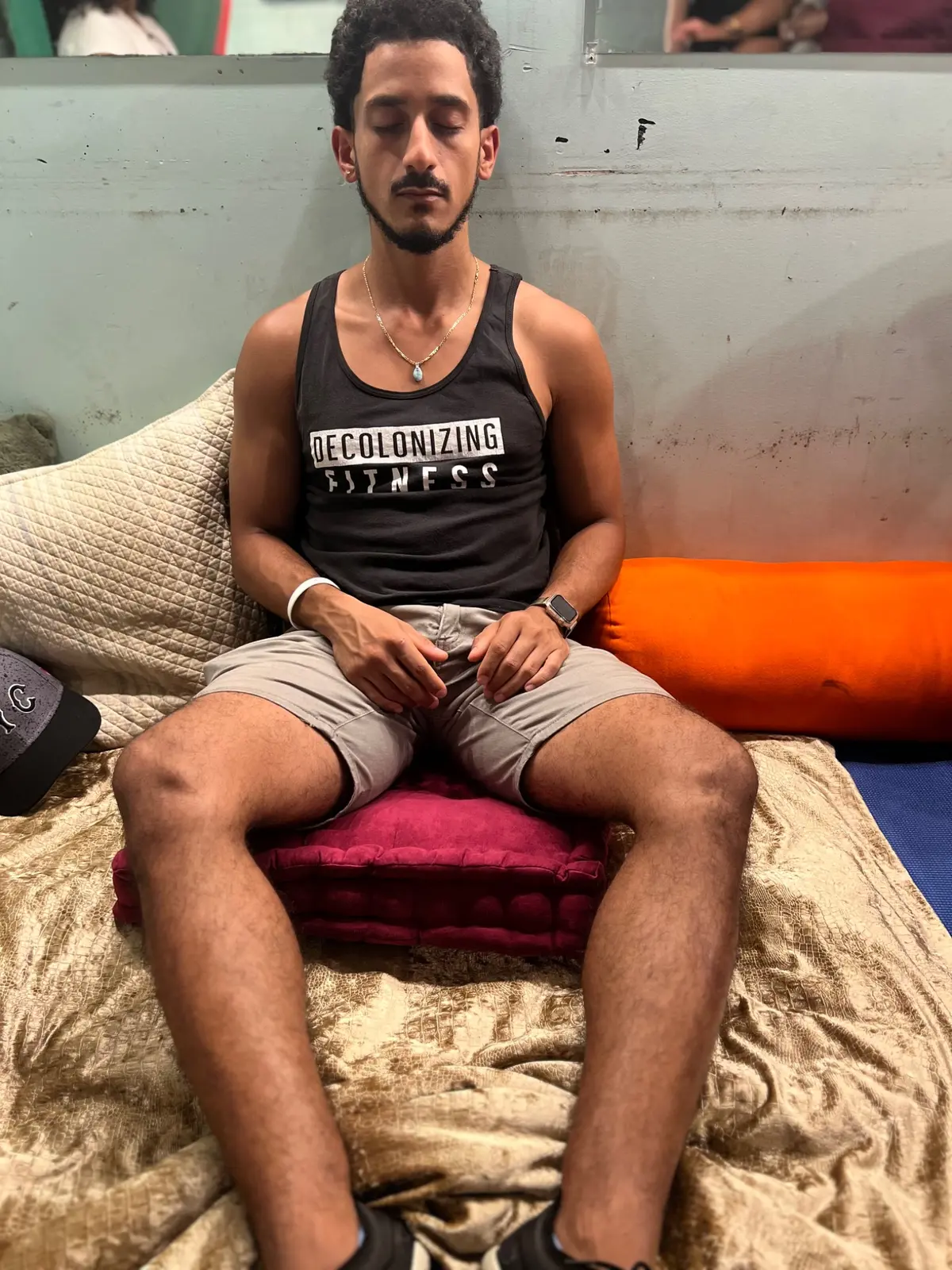 Participant resting on a cushioned bench