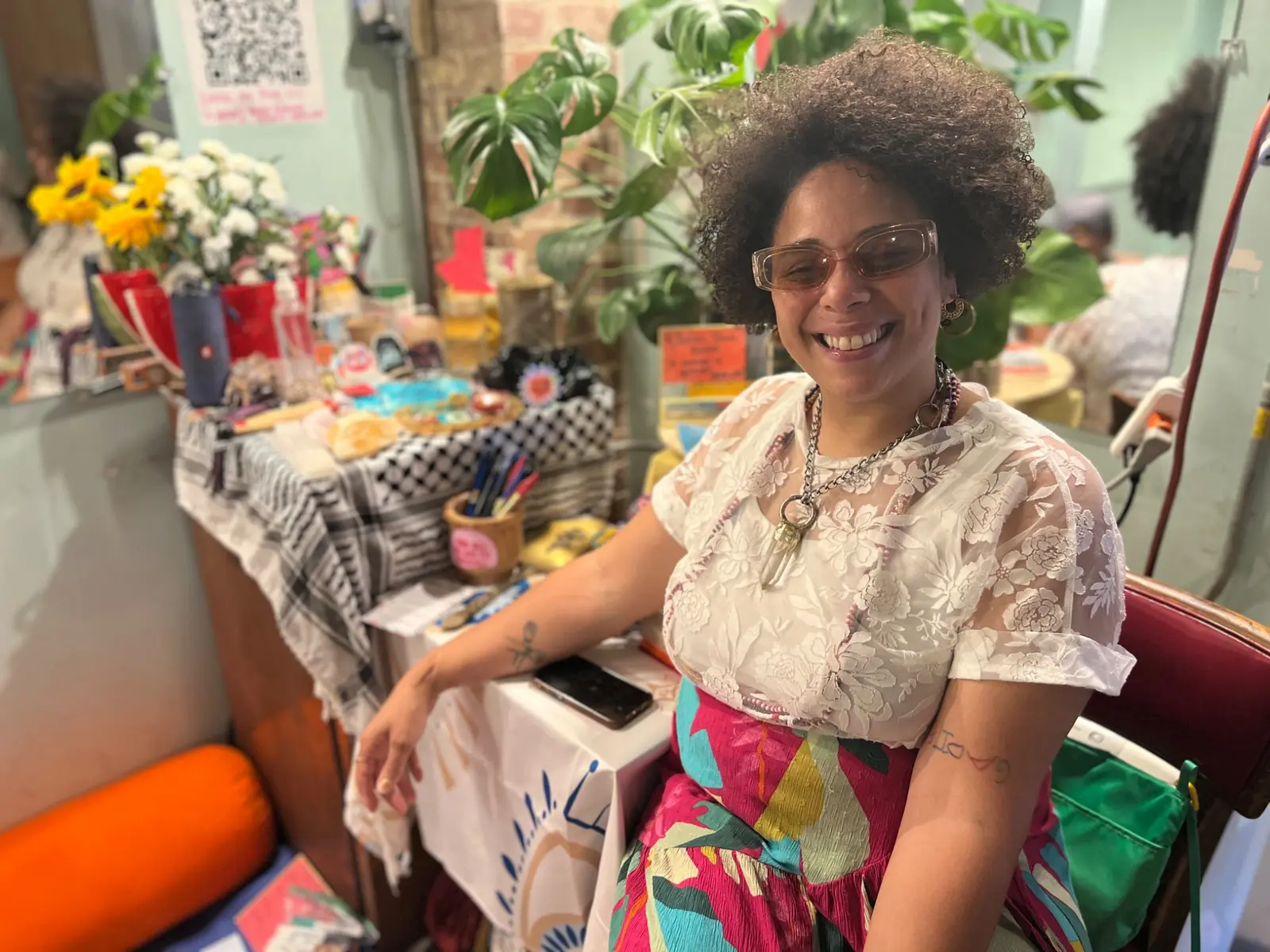 Community member smiling at an arts and wellness event