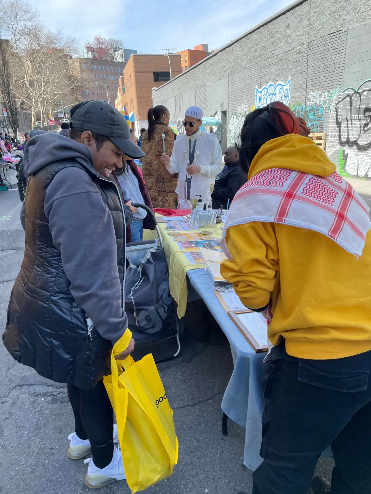 People visiting a community wellness table