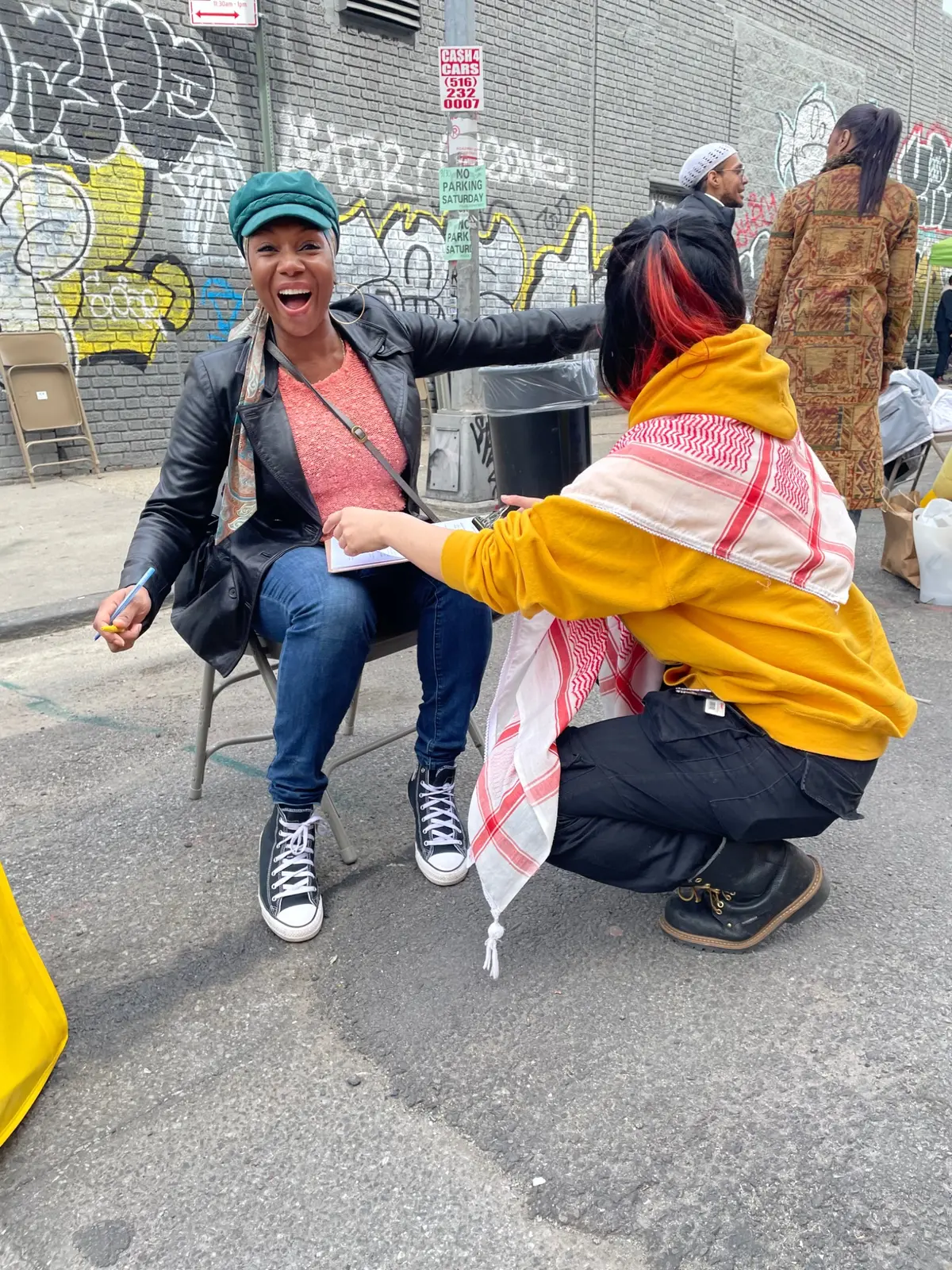 Two community members sharing a joyful moment