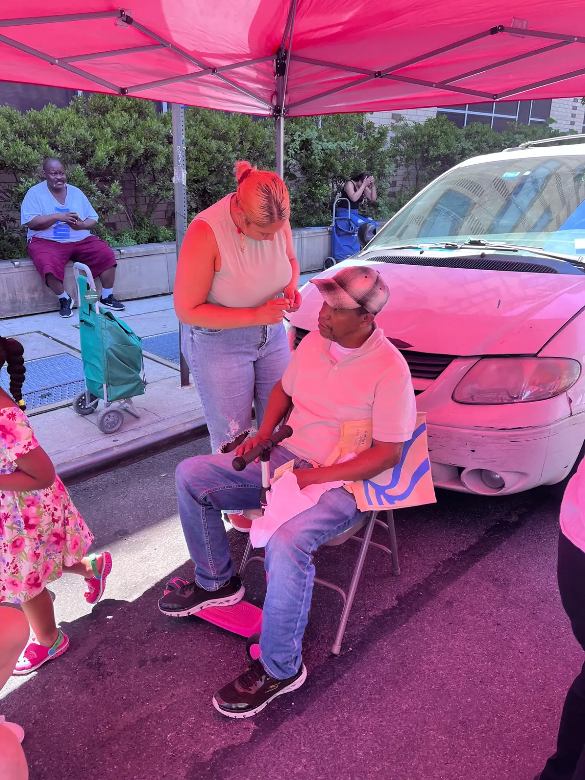 Practitioner speaking with a seated attendee